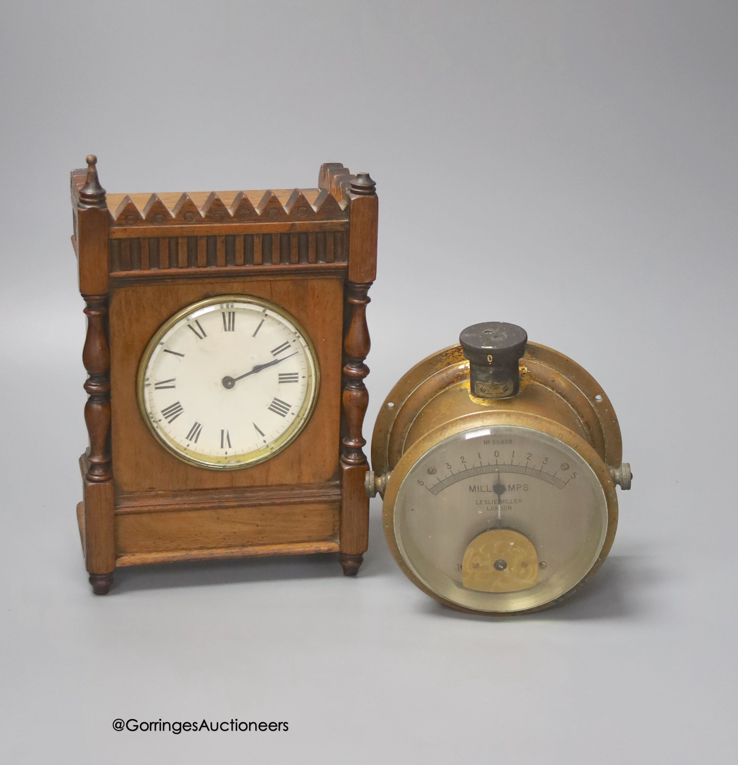 A French walnut cased mantel timepiece, with key, 23cm, and a brass cased Milli-Amps scale